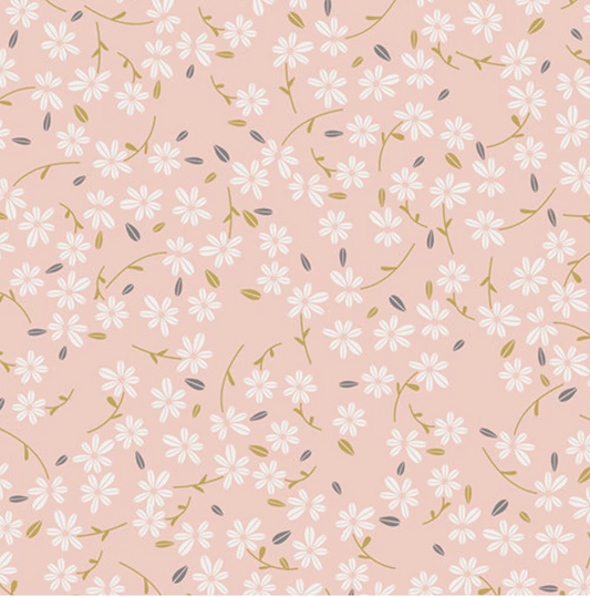 Flat lay view of Season Waltz pink floral quilting cotton by Art Gallery Fabrics featuring a repeating pattern of small, dainty white daisy-like flowers with delicate green stems and golden leaves on a soft blush pink background.